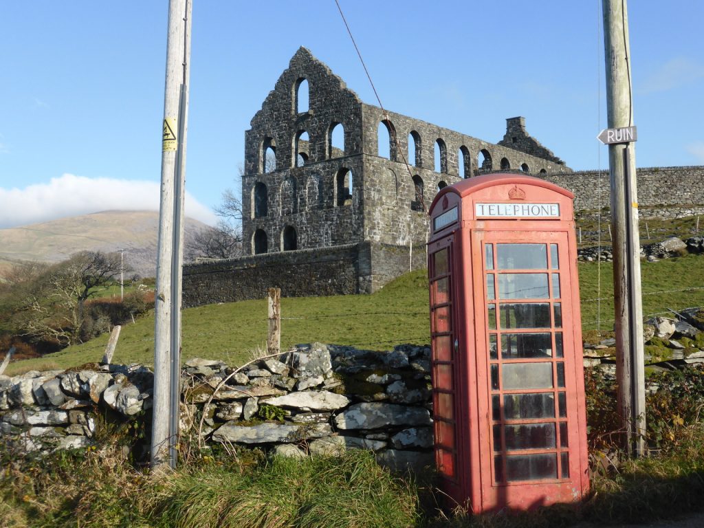 red phonebox and ruined mill