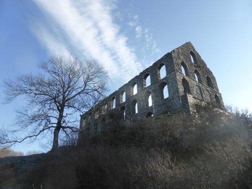 clouds through roofless old mill