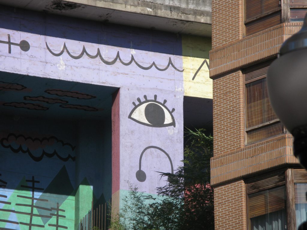 eye painted on concrete roadbridge