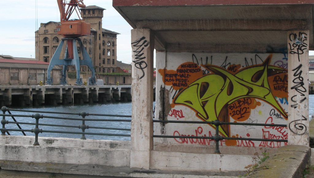 dockside view with tagged bus shelter