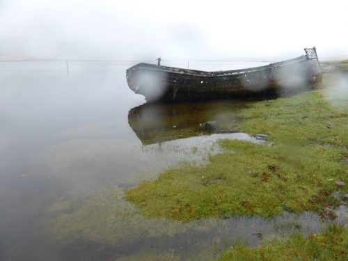 boat and saltmarsh in rain