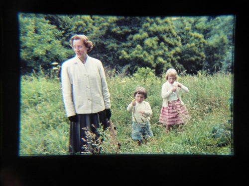 woman and girls in long grass