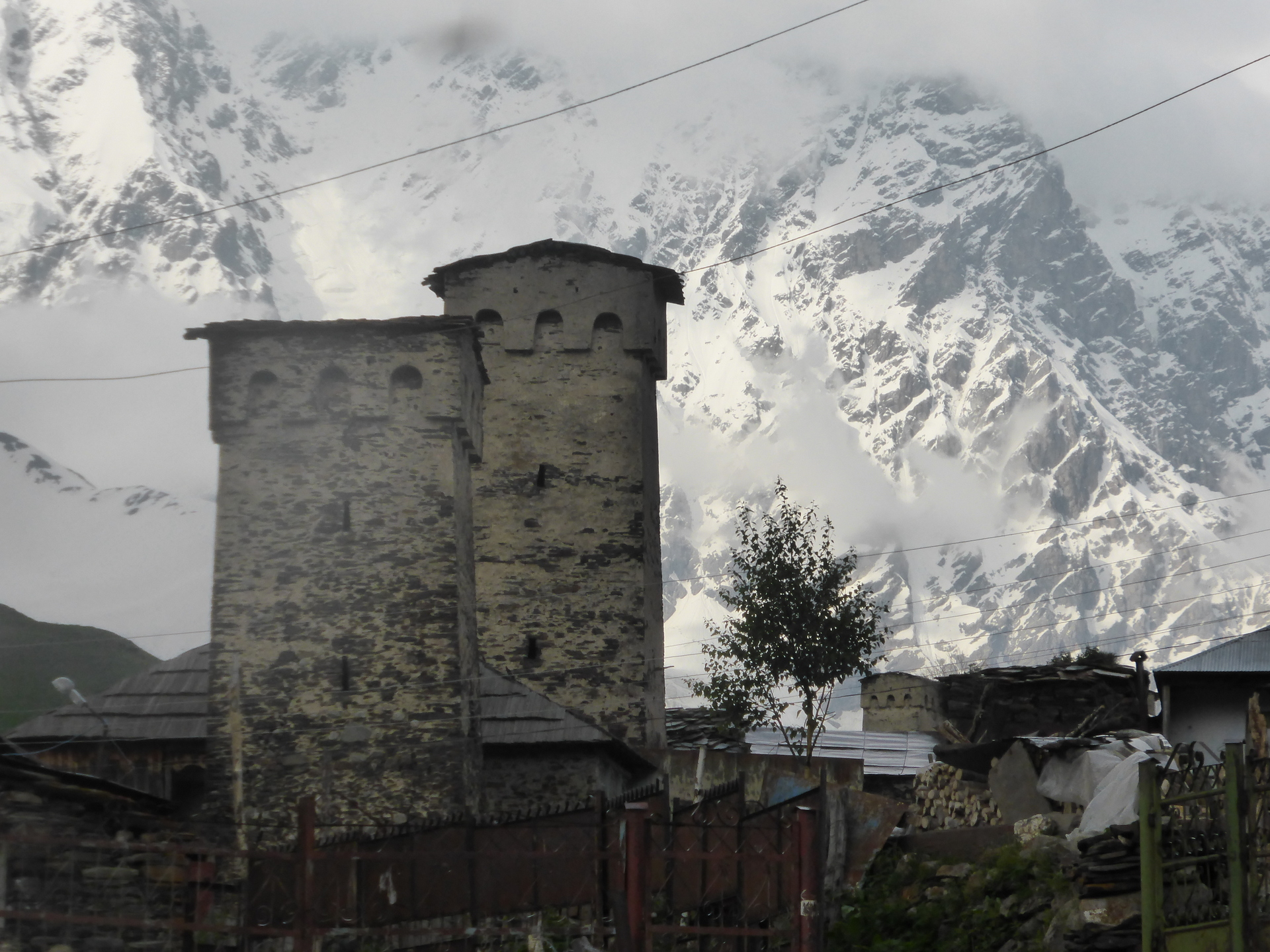 white-painted stone towers against snowy mountainside