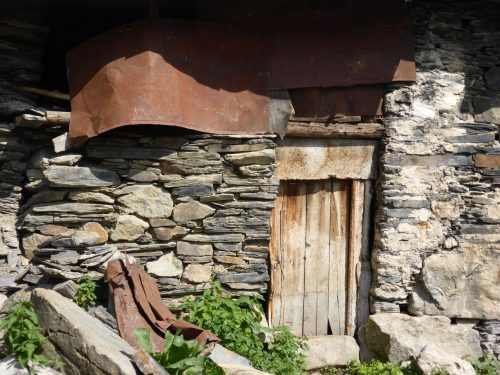 old stone, wood and metal house detail