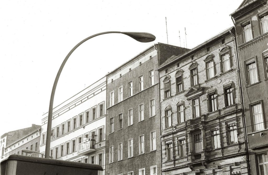 building facades meet curvy streetlamp