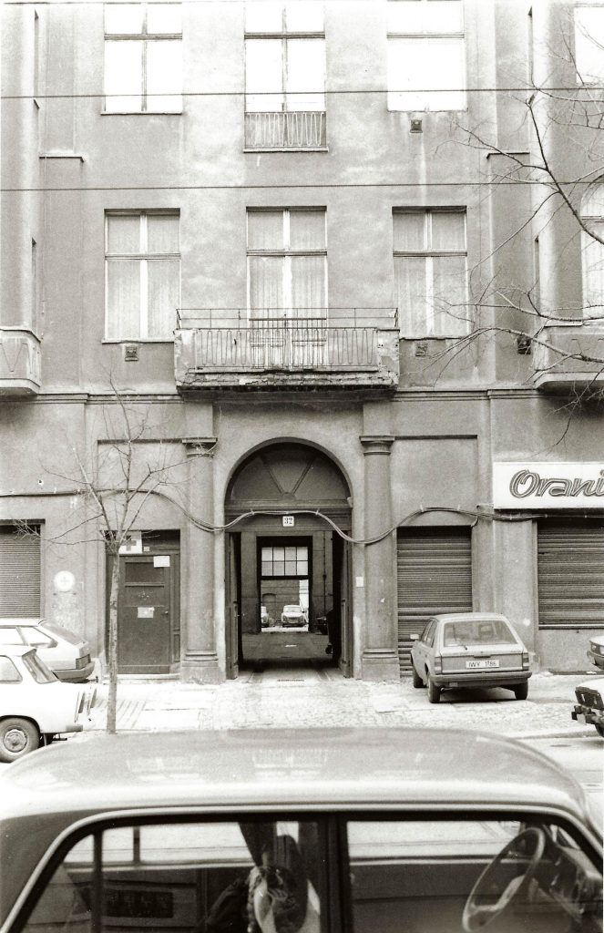 building entrance and cars