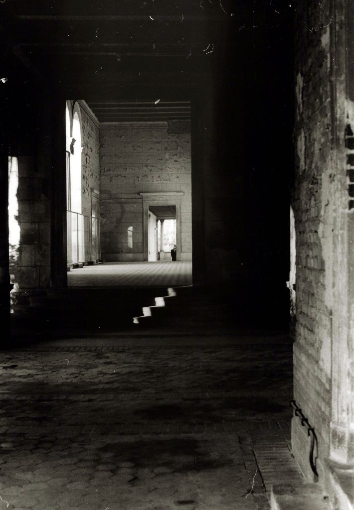 sunlight picks out steps inside dark building