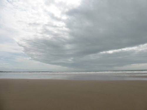 cloud front moves across beach