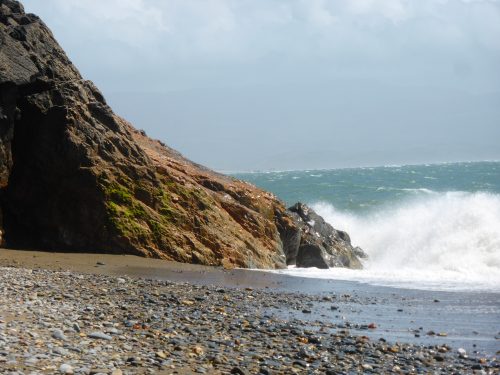 wave hits rock