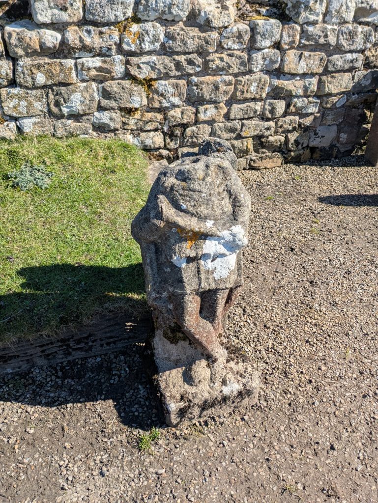 headless stone statue