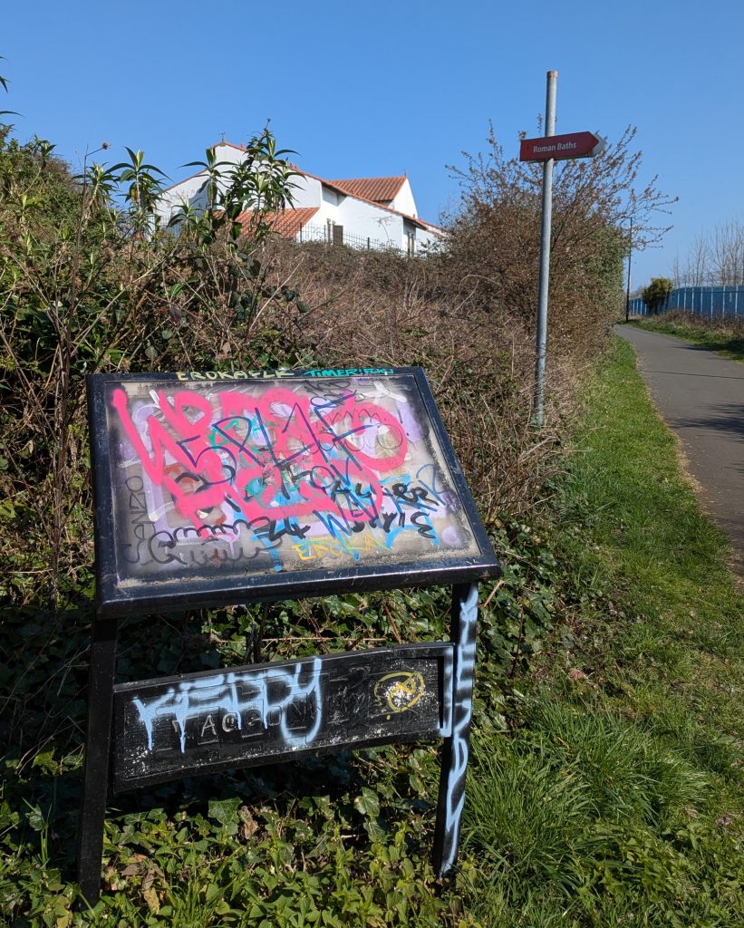 graffitti on information board
